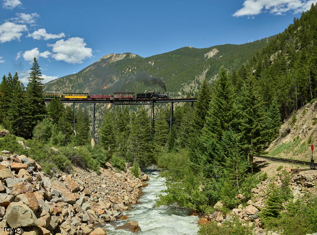 A steam train crosses the 156-foot-tall Bass Point Creek Bridge. Original image from Carol M. Highsmith’s America, Library of Congress collection. Digitally enhanced by rawpixel.